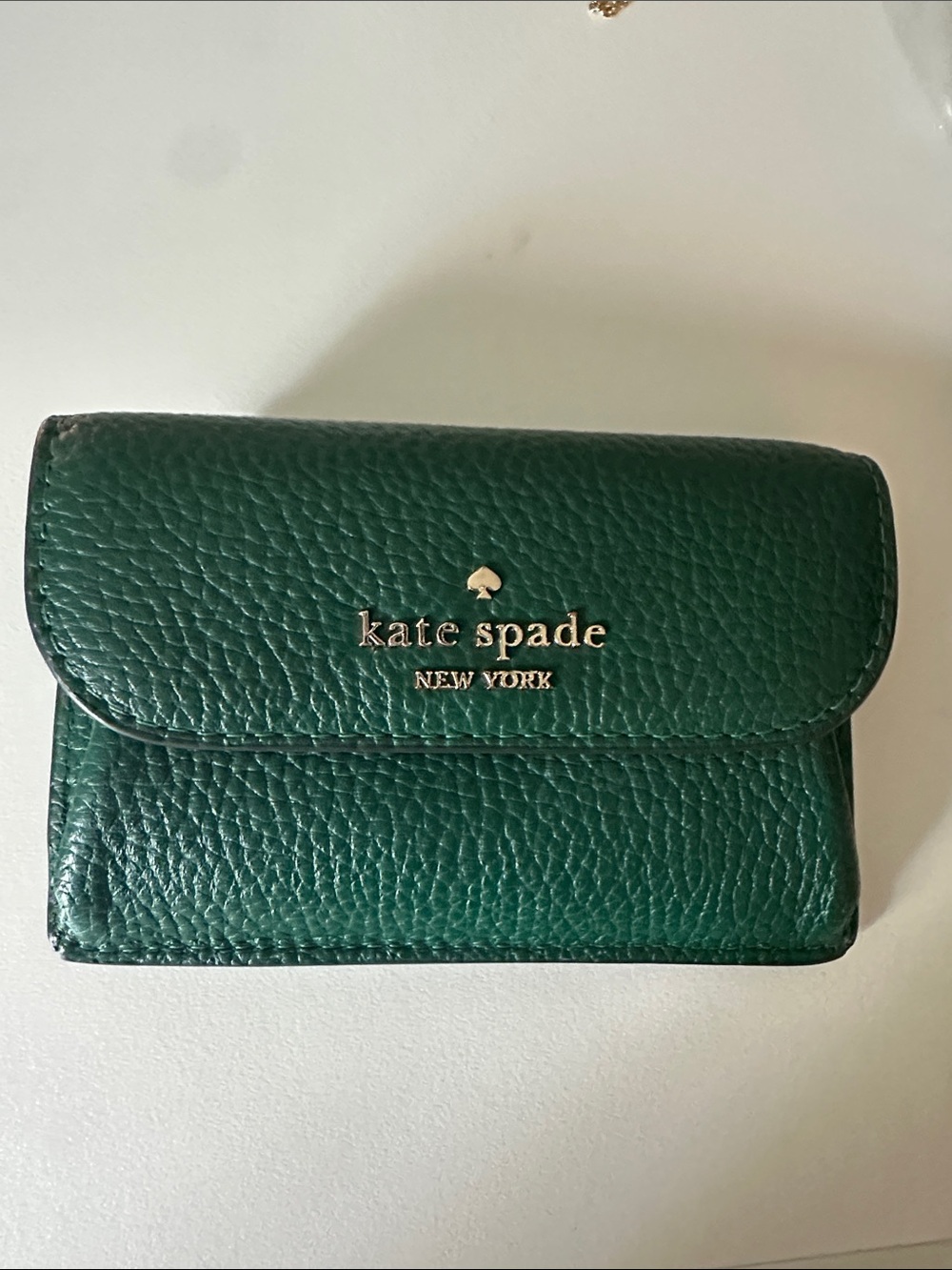 kate spade emerald pebbled leather mini wallet with gold logo